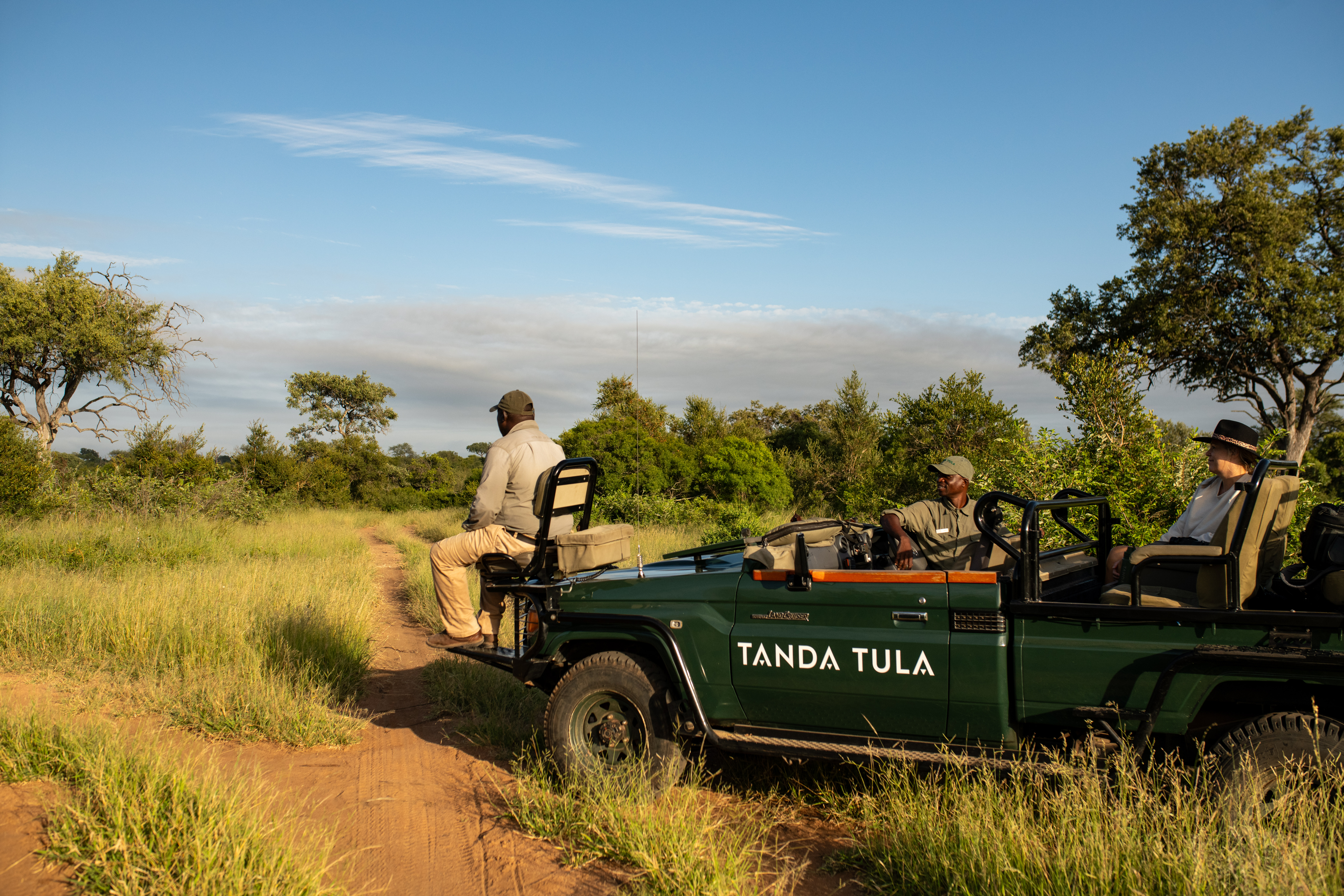 Guests heading out on a morning game drive with expert guide and tracker in the Timbavati.